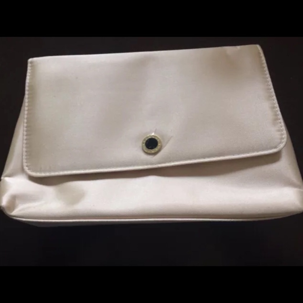 Bvlgari makeup case in offwhite silk.